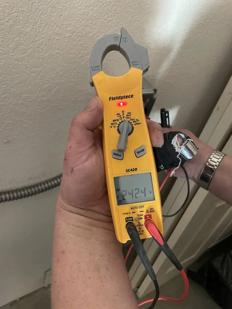Voltage testing with clamp meter during Circuit Breaker Repair in Silverton